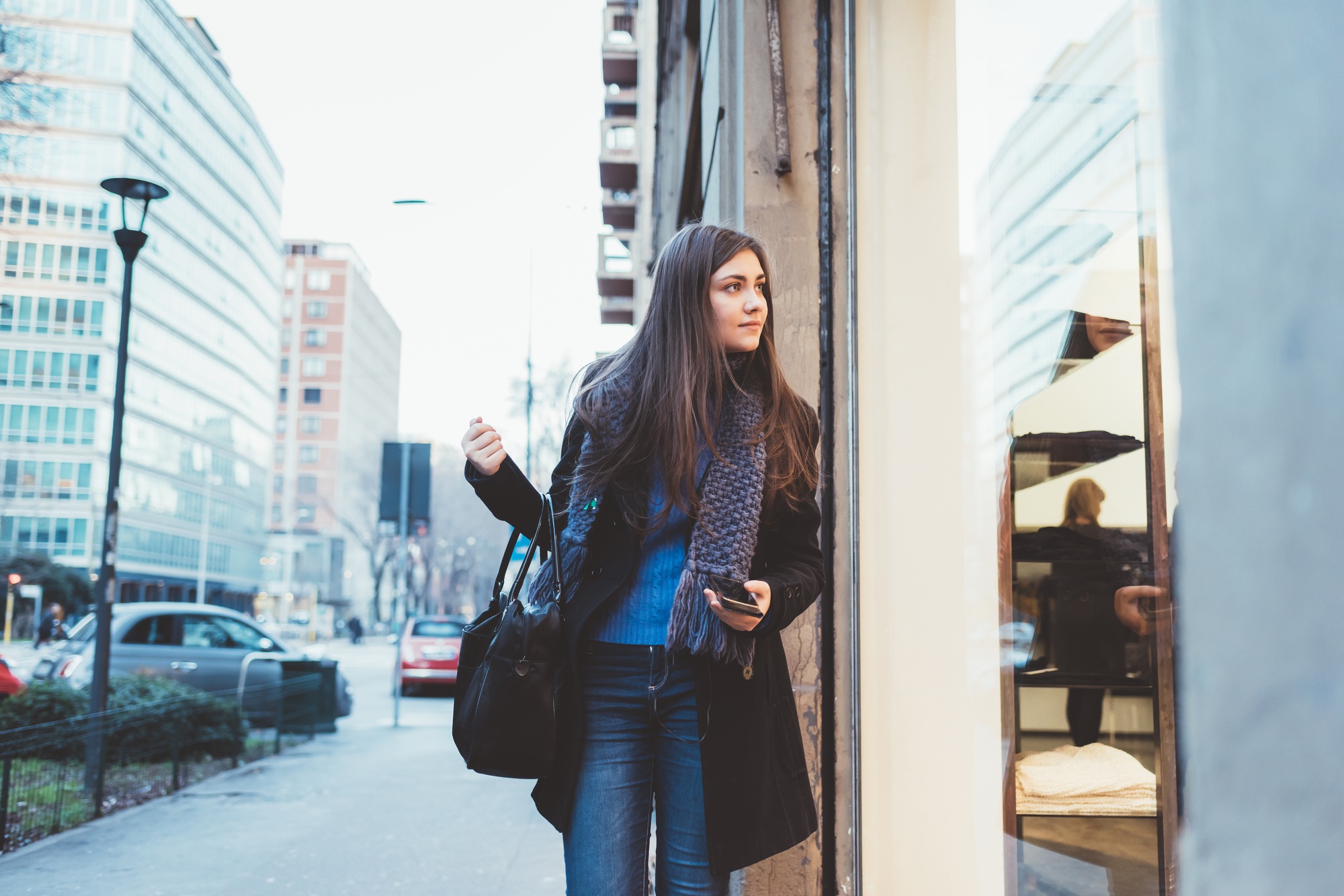 Young woman window shopping