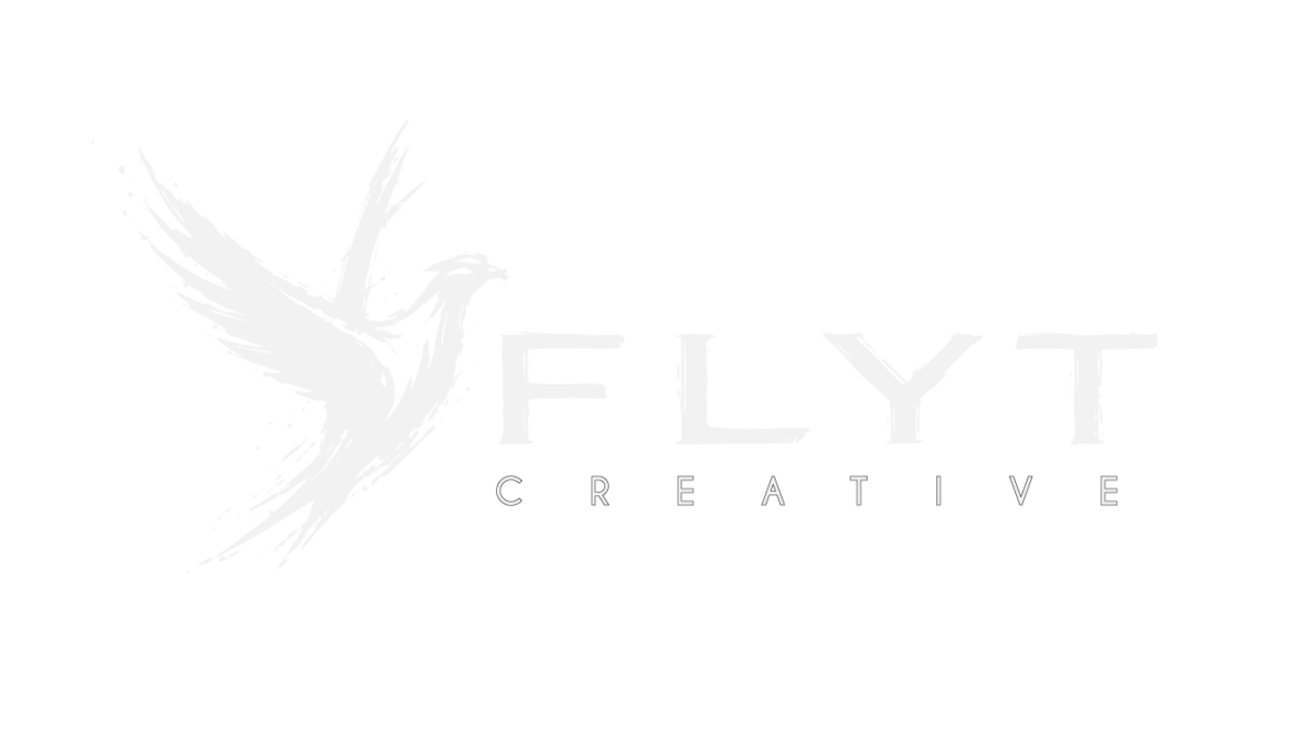 FLYT Creative logo: white bird in flight beside text
