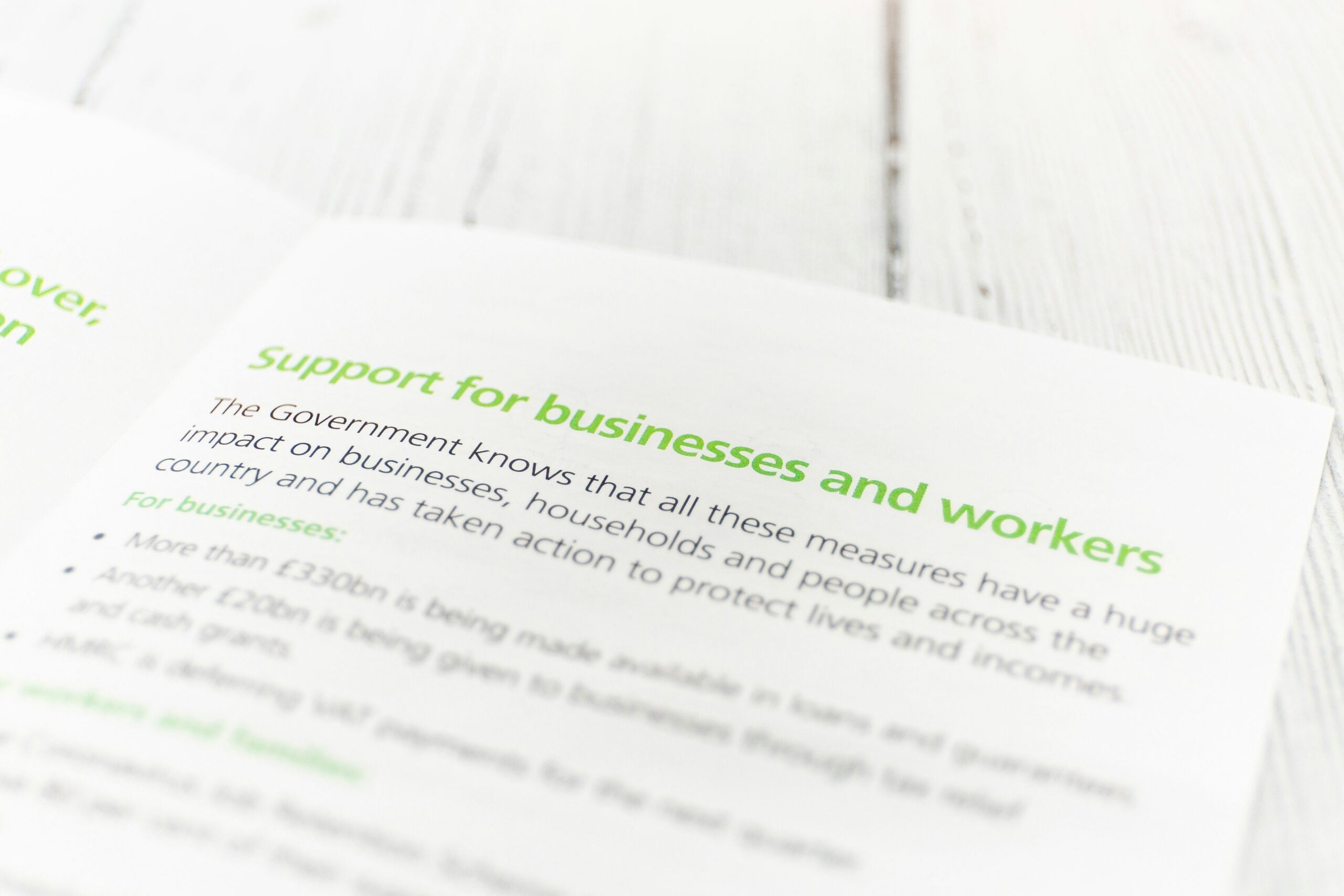 Brochure page titled "Support for businesses and workers" detailing government aid