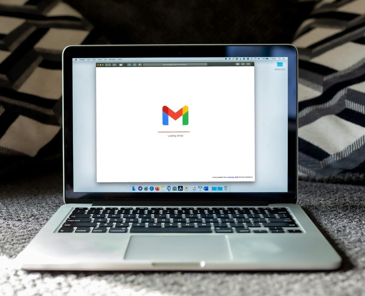 Laptop displaying Gmail loading screen, symbolizing email marketing.