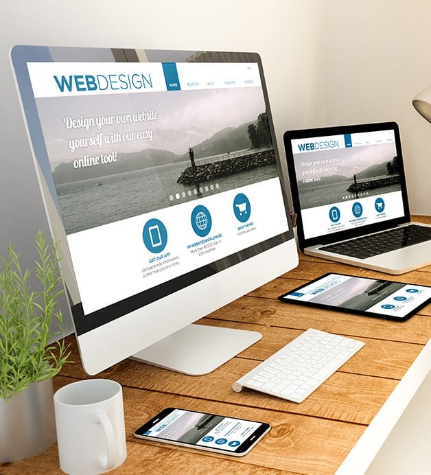 Web design portfolio: Desktop, laptop, tablet, and phone displaying website designs.